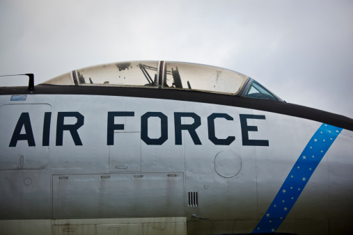 The vertical stabiliser of a United States Air Force McDonnell Douglas KC-10A Extender plane, registration 84-0191, parked at Sydney Kingsford-Smith Airport.  The letters \