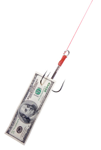 a 100 dollar bill is attached to a large fishing hook