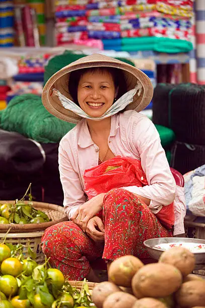 vietnam lady market vendor merchant looking at view