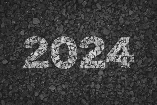 Vector illustration of Black or dark grey coloured pebbles gravel road horizontal vector backgrounds with small stones pattern allover like a pebbled road with text 2024 painted in white colored paint