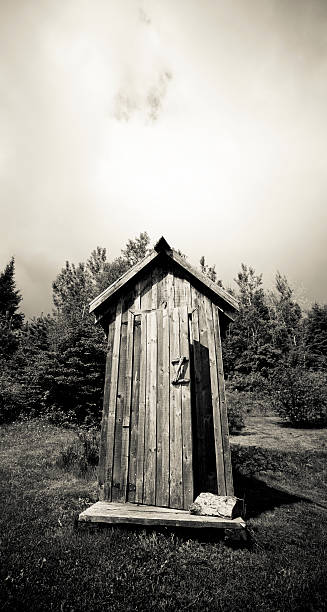 Antique Outhouse Antique outhouse... do you really want to go to pee in... this?? Black and white, toned image. public restroom photos stock pictures, royalty-free photos & images