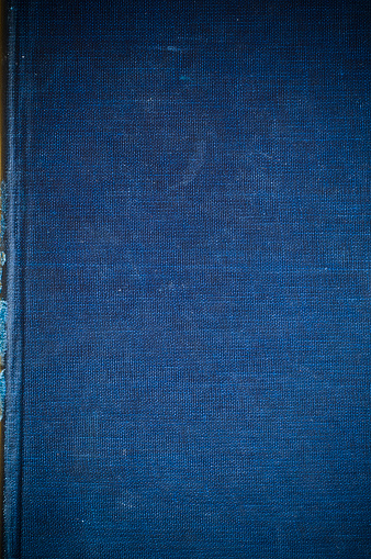 Indigo Blue linen texture from vintage book cover for background with copy-space.