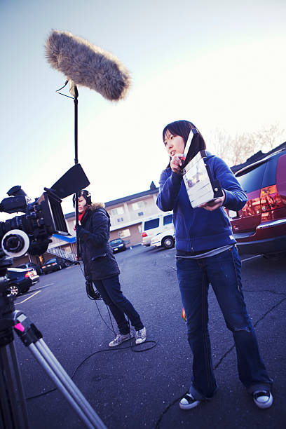 On Location! The 2nd Assistant Camera marks the shot so that the film can be synched back up with the separately recorded sound.More filmmaking images: in synch stock pictures, royalty-free photos & images
