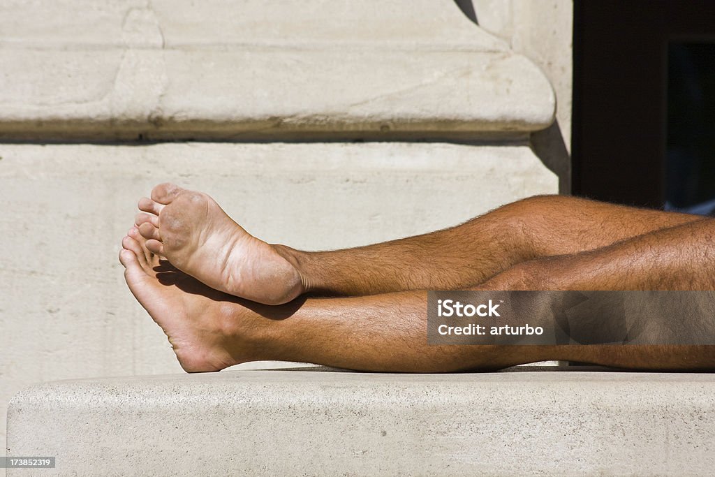 suntanned male legs legs in the afternoon sun Active Lifestyle Stock Photo