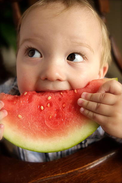 istock Baby Eating Watermelon 173852544