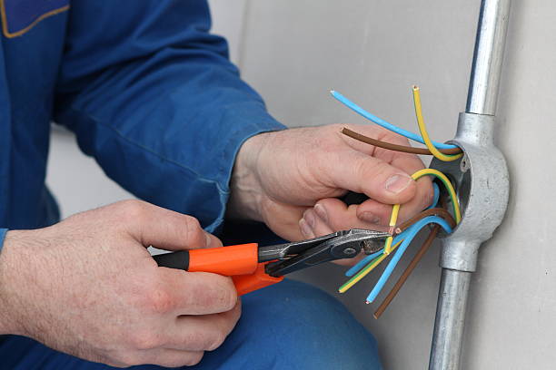 Electrician preparing cables for connection. Electrician preparing cables for connection to an outlet. wire cutter stock pictures, royalty-free photos & images