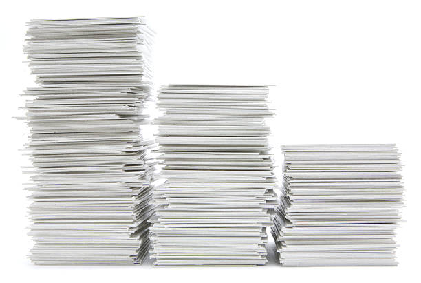 Three stacks of hand trimmed cards stock photo