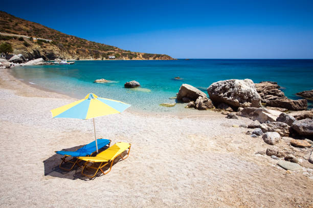 istock Sun chairs and umbrella on beach 173852846