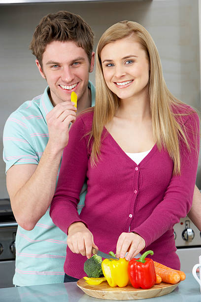 Couple preparing meal stock photo