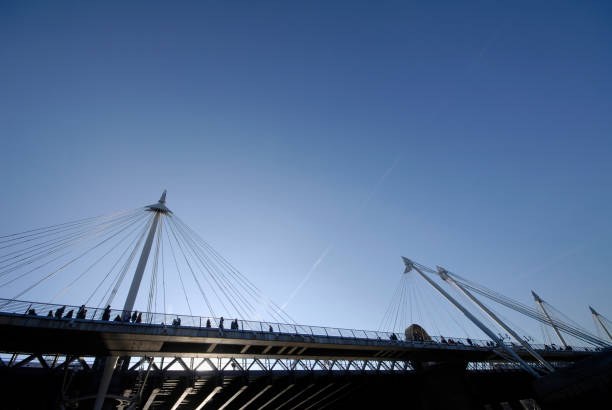 istock People crossing Hungerford Bridge over River Thames 173853134