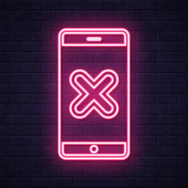 Vector illustration of Smartphone with cross mark. Glowing neon icon on brick wall background