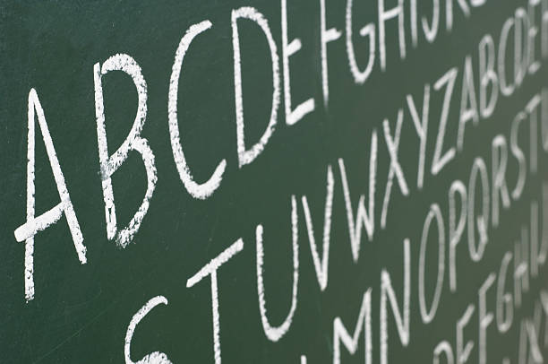abc letters on a blackboard - handwriting blackboard alphabet alphabetical order сто�ковые фото и изображения