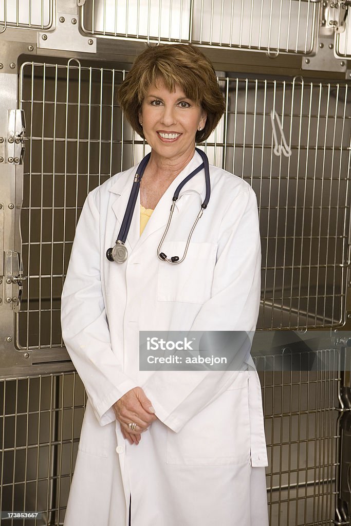 Veterinarian Vet in front of empty kennels. Please view all images from this series along with all 40-49 Years Stock Photo