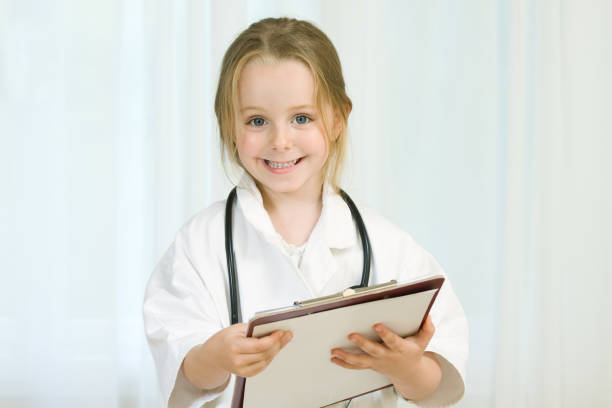 istock Little girl playing as a doctor 173853813