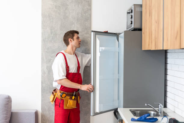 istock Electrician Technician Working To Repair Refrigerator Or Fridge Appliance 1738538915