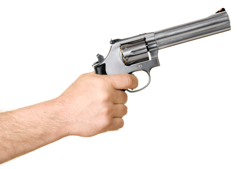 Man pointing a cocked and loaded .357 Magnum revolver. (Adobe RGB)