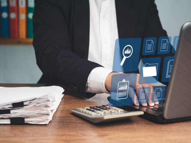 istock Businessman working at a laptop and digital documents on a virtual screen 1738542289