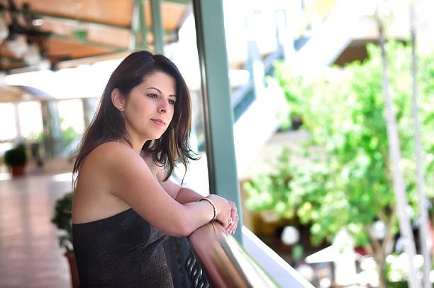 istock Woman looking over veranda 173854526