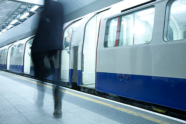 istock Businessman Walking Along London Subway Train 173854612