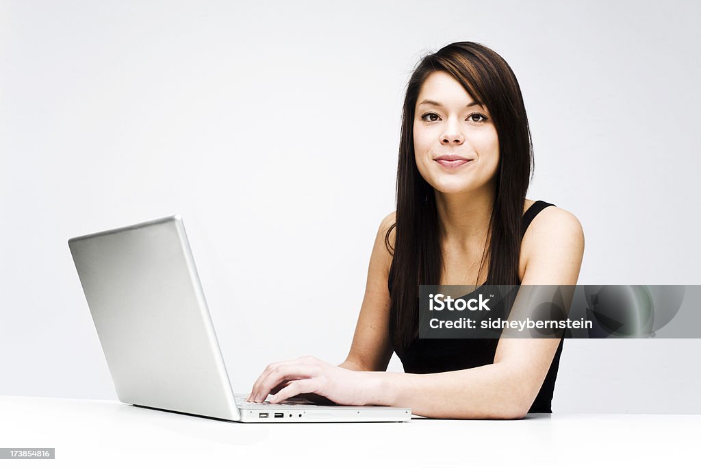 Young woman with laptop Young attractive woman using laptop on white background 20-29 Years Stock Photo