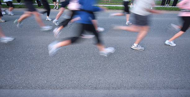 istock Runners Legs at a Cross Country Relay Race Start 173855340