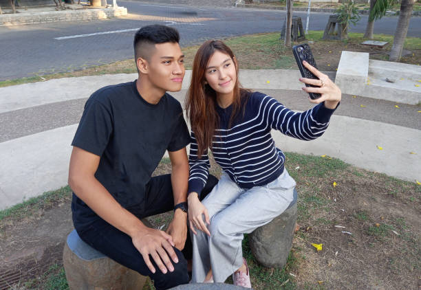 istock Two best friend is hanging out and use a smart phone. 1738556031