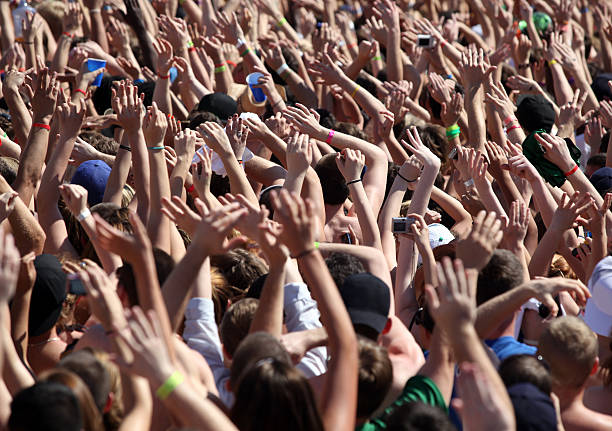 istock Large Spring Break Party Crowd of People Hands at Concert 173856576