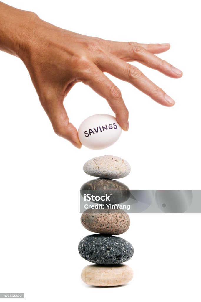 Balancing Act - Savings "Subject: Life balancing act, stacking personal savings against financial risk." Adult Stock Photo