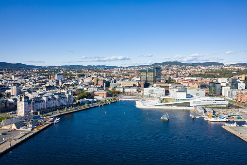 Norway Oslo Cityscape. Aerial Drone view over Oslo Downtown Harbour Waterfront Cityscape in Summer. Aerial Cityscape View over sunny Oslo and Harbor Waterfront under a beautiful blue summer sky. Oslo, Norway, Scandinavia, Northern Europe