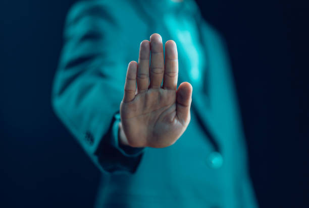 istock Man showing hand palm gestures stop 1738572350