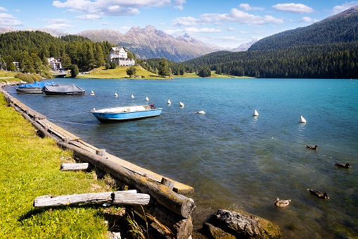 Holidays in Switzerland - view of Lake Sankt Moritz and Piz Muragl mountain in the background