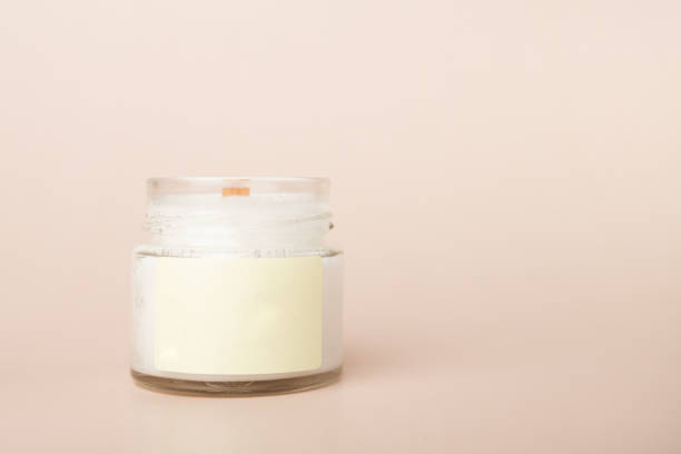 istock candle with blank label mock up on a beige background, aromatherapy, natural home decor, copy space 1738575193