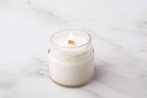 istock Burning Candle in the bathroom on a marble background, cozy atmosphere 1738575256