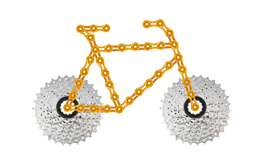 A bicycle made of golden chain links and bike cassette on white background