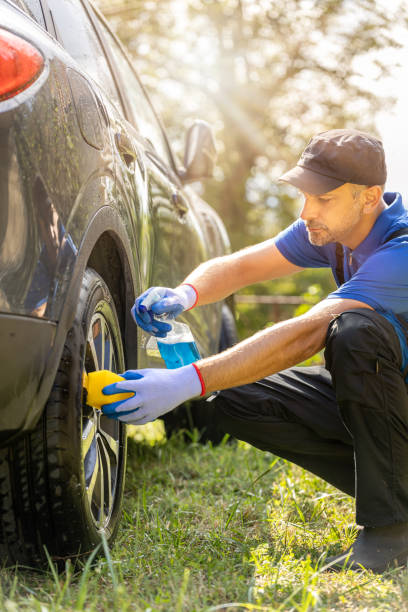 istock Man worker washing car alloy wheel. 1738582480