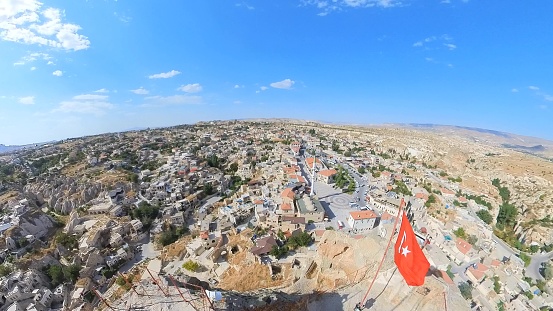 Ortahisar Castle in Cappadocia, Turkey, is a historic fortress perched atop a rock formation. It boasts stone walls, tunnels, and chambers, offering a window into its centuries-old past.
