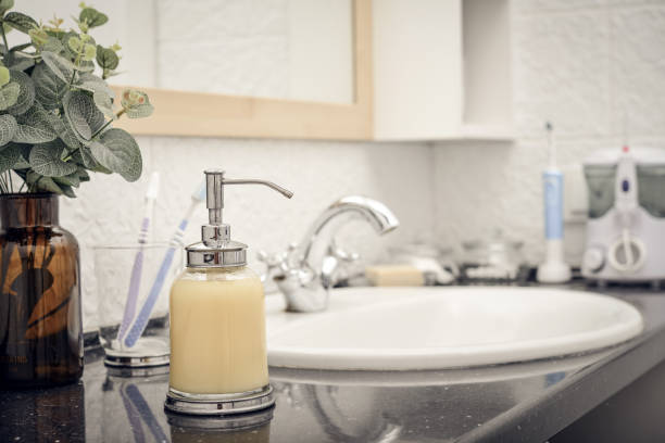 istock Bathroom set with glass liquid soap dispenser 1738594939