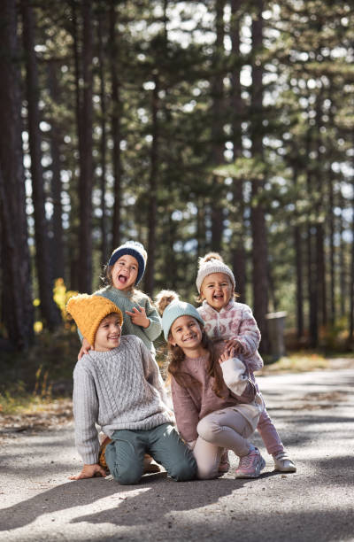 istock Happy children enjoying autumn in forest 1738600412