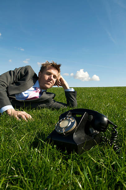 istock Businessman Sits Waiting By the Phone 173861236