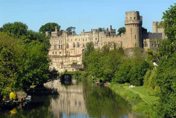 Warwick Castle. Warwick Castle reflected in the river on a beautiful spring morning. warwick uk stock pictures, royalty-free photos & images