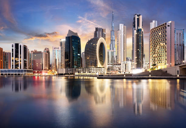 Dubai skyline with skyscraper and reflection in canal - nice cityscape in United Arab Emirates Dubai skyline with skyscraper and reflection in canal - nice cityscape in United Arab Emirates khalifa stock pictures, royalty-free photos & images