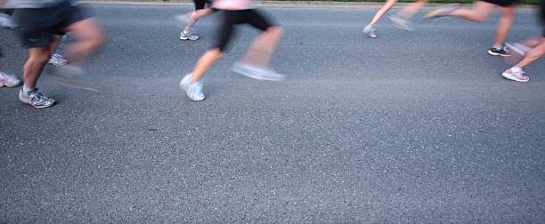 istock Runners Legs at a Cross Country Relay Race Start 173863786