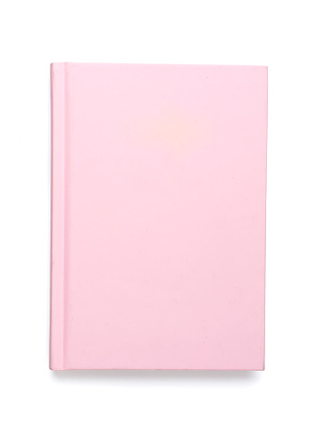 Pink closed notebook isolated on white, top view