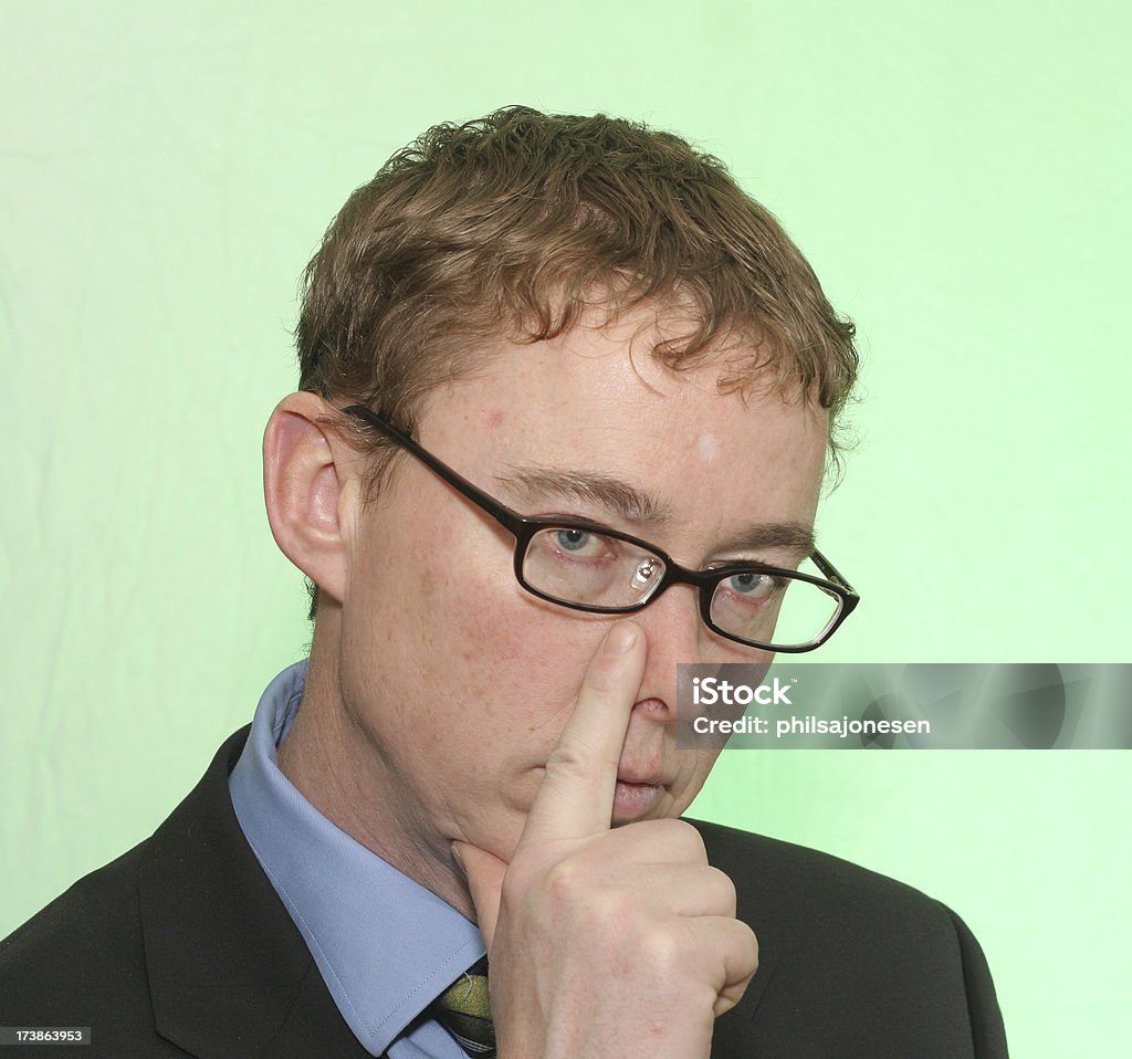 Businessman's Secret Signal "A wealthy businessman making a secret signal hand gesture pointing at nose.For more of this businessman, please click here:" 40-44 Years Stock Photo