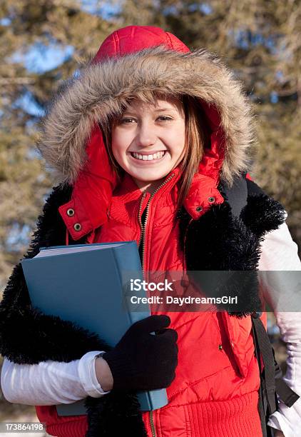 Smiling Female Student Outdoors Holding School Text Book Stock Photo - Download Image Now