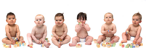 istock Six babies sitting in a row 173865225