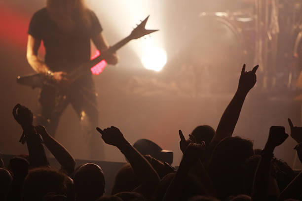 Guitarist on stage Guitarist on a big stage hair band stock pictures, royalty-free photos & images