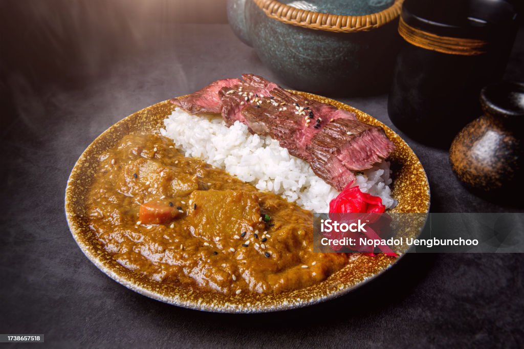 Japanese style beef grilled with curry rice Yaki niku kare rice or Japanese style beef grilled with curry rice Curry - Meal Stock Photo
