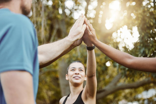 istock Hands, high five with exercise group and success in team of people outdoor, help and support with training. Huddle, collaboration or partnership with solidarity, trust in fitness community with goals 1738659788