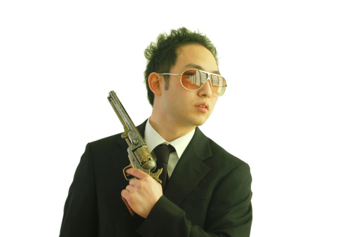 Asian man holding a pistol.Similar Shots: